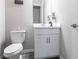 Well-lit half bathroom featuring a single vanity with modern fixtures and a neutral color palette at 16134 Paynes Mill Dr, Bradenton, FL 34211