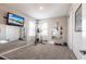 This exercise room features floor-to-ceiling mirrors, a television, and exercise equipment at 16134 Paynes Mill Dr, Bradenton, FL 34211