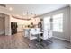 Bright, modern kitchen open to the dining area, featuring white cabinets and sleek countertops at 16134 Paynes Mill Dr, Bradenton, FL 34211