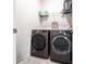 Laundry room featuring a modern washer and dryer set, providing convenience and functionality at 16134 Paynes Mill Dr, Bradenton, FL 34211