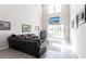Spacious living room boasting soaring ceilings, gray tile flooring, and abundant natural light at 16134 Paynes Mill Dr, Bradenton, FL 34211