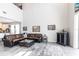 Open-concept living room featuring high ceilings and a view of the kitchen at 16134 Paynes Mill Dr, Bradenton, FL 34211