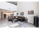 Open-concept living room showcasing high ceilings and seamless access to the modern kitchen at 16134 Paynes Mill Dr, Bradenton, FL 34211