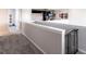Upstairs loft featuring neutral walls, white trim, grey carpet and decorative wrought iron railing at 16134 Paynes Mill Dr, Bradenton, FL 34211
