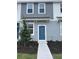 Charming two-story home with a blue front door and landscaped yard at 16622 San Nicola Pl, Bradenton, FL 34211