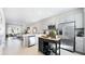 Spacious kitchen featuring an island, stainless steel appliances, and modern countertops at 16622 San Nicola Pl, Bradenton, FL 34211