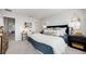 Comfortable bedroom with a large bed, stylish decor, and ample natural light at 16622 San Nicola Pl, Bradenton, FL 34211