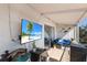 Inviting balcony with comfortable seating and a wall-mounted TV, perfect for outdoor relaxation at 1714 69Th W Ave # C402, Bradenton, FL 34207
