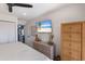 Bedroom showcasing modern decor, dresser, and a TV, offering a comfortable and stylish retreat at 1714 69Th W Ave # C402, Bradenton, FL 34207