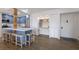 Eat-in kitchen with blue cabinets, white countertops, an island, and a built-in desk/shelving unit at 1714 69Th W Ave # C402, Bradenton, FL 34207