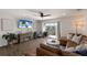 Spacious living room with luxury vinyl plank flooring, and sliding glass doors out to a balcony at 1714 69Th W Ave # C402, Bradenton, FL 34207