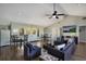 Inviting living room with vaulted ceilings, comfortable seating, and a flatscreen TV at 1714 69Th W Ave # C402, Bradenton, FL 34207