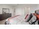 Serene bedroom featuring neutral colors, ample storage, and soft carpeting at 17620 Crescent Moon Loop, Bradenton, FL 34211