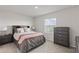 Cozy bedroom with coordinated furniture, carpet floors and lots of natural light at 17620 Crescent Moon Loop, Bradenton, FL 34211