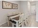 Elegant dining room featuring a wood table with seating for six, complemented by stylish decor and lighting at 17620 Crescent Moon Loop, Bradenton, FL 34211
