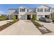 Inviting townhomes feature attached garages, well-manicured landscaping, and a welcoming front entrance at 17620 Crescent Moon Loop, Bradenton, FL 34211