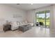 Inviting living room with a comfortable couch, stylish decor, and a seamless transition to the outdoors at 17620 Crescent Moon Loop, Bradenton, FL 34211
