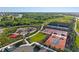 Aerial view of neighborhood recreation area, including tennis courts and playground at 17620 Crescent Moon Loop, Bradenton, FL 34211