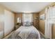 Neutral bedroom featuring a comfortable bed, soft textures, and ample natural light from the window at 2105 Georgia Ave, Englewood, FL 34224