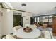 Cozy dining area with stylish chandelier, seamlessly connected to the kitchen and living room at 2105 Georgia Ave, Englewood, FL 34224