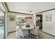 Charming dining area adjacent to the kitchen featuring a sliding glass door with pool views at 2105 Georgia Ave, Englewood, FL 34224