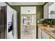 Bright kitchen view showcases modern appliances with dining area at 2105 Georgia Ave, Englewood, FL 34224