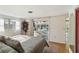 Comfortable main bedroom with view of screened in porch and pool at 2105 Georgia Ave, Englewood, FL 34224