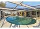 Refreshing pool in a screened enclosure for outdoor enjoyment and relaxation at 2105 Georgia Ave, Englewood, FL 34224