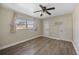 Bedroom features a ceiling fan, window, and two closets at 2128 Harley Ave, Sarasota, FL 34235