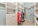 Well-organized closet with built-in shelving and ample hanging space at 223 Saint James Park, Osprey, FL 34229