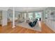 Bright living room featuring a view of the pool, a stylish seating area, and a built-in bar at 223 Saint James Park, Osprey, FL 34229