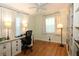 Well-lit home office featuring built-in shelving and a spacious desk area, perfect for remote work at 230 47Th W St, Bradenton, FL 34209