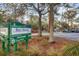 Bay Street park sign featuring a dog park surrounded by mature trees in a Sarasota County community at 232 Explorer Dr # 15, Osprey, FL 34229