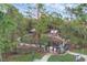Aerial view of the fenced dog park within a tree-filled park with walking trails and shaded picnic areas at 232 Explorer Dr # 15, Osprey, FL 34229