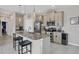 Well-lit kitchen featuring stainless steel appliances, a spacious island, and modern pendant lights at 232 Explorer Dr # 15, Osprey, FL 34229