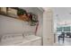 Convenient laundry room with a washer and dryer, featuring shelving for storage at 232 Explorer Dr # 15, Osprey, FL 34229