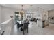 Bright, open-concept living space featuring modern decor and a connected dining and kitchen area at 232 Explorer Dr # 15, Osprey, FL 34229