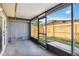 Enclosed back porch with view of fenced backyard at 2400 Stanford Ave, Bradenton, FL 34207