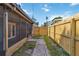 View of the home's backyard, accessible from the back porch and featuring a privacy fence at 2400 Stanford Ave, Bradenton, FL 34207