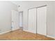 Bedroom featuring tile flooring, neutral walls, closet with sliding doors and two entry doors at 2400 Stanford Ave, Bradenton, FL 34207