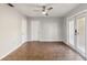 Neutral bedroom with closet and doors leading outside, providing ample space and natural light at 2400 Stanford Ave, Bradenton, FL 34207