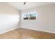 Bedroom featuring tile flooring, neutral walls, a ceiling fan and a window at 2400 Stanford Ave, Bradenton, FL 34207