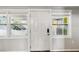 Bright entryway with a view to the carport through the sidelight windows at 2400 Stanford Ave, Bradenton, FL 34207