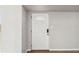Bright entryway featuring a white door with decorative glass, tile flooring, and neutral wall paint at 2400 Stanford Ave, Bradenton, FL 34207
