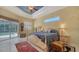 Spacious bedroom with tiled floors, ceiling fan, and patio access, creating a tranquil retreat at 241 Willow Bend Way, Osprey, FL 34229