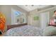 Comfortable bedroom featuring a sliding glass door that opens to a covered patio area at 241 Willow Bend Way, Osprey, FL 34229