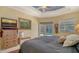 Airy bedroom features tiled floors, sliding glass doors to a pool, and a custom ceiling design at 241 Willow Bend Way, Osprey, FL 34229