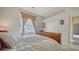 Inviting bedroom with a double closet, window, and doorway, offering comfort and convenience at 241 Willow Bend Way, Osprey, FL 34229