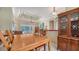 Dining room features a tray ceiling and views of the pool area, perfect for gatherings and enjoying the scenic backdrop at 241 Willow Bend Way, Osprey, FL 34229