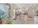 Bright entryway leading to a spacious living room with a kitchen and breakfast bar at 241 Willow Bend Way, Osprey, FL 34229